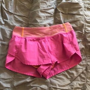 girls pink and orange ivivva workout shorts